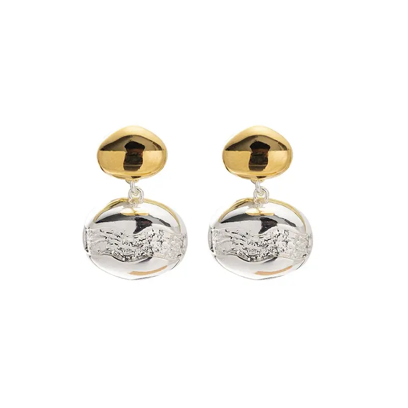 brass-gold-plated-stud-earrings.jpg Close-up of brass gold-plated stud earrings showcasing elegant minimalist design.