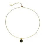 LIVKE’s gold-plated agate heart necklace styled with black silk dress for timeless minimalist elegance