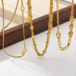 Luxe Layered Gold Necklace Set 4 Three LIVKE gold layered necklaces with minimalist pendants, styled over a white tee for casual-chic everyday outfits.