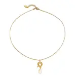 Vintage Brass Pearl Necklace 1 English: “Close-up of LIVKE’s 18K gold plated oval bead necklace in vintage palace style, styled elegantly on a model.”