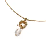 Vintage Brass Pearl Necklace 5 English: “Close-up of LIVKE’s 18K gold plated oval bead necklace in vintage palace style, styled elegantly on a model.”