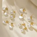 Vintage Heart Stud Earrings 2 LIVKE’s vintage heart stud earrings with textured gold finish, styled with a denim jacket for casual-chic outfits.