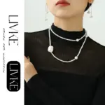 18K Gold Baroque Pearl Necklace 4 LIVKE’s gold baroque pearl necklace styled in three ways: as a choker, layered chains, and wrapped bracelet for boho versatility.