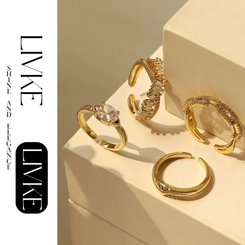 LIVKE’s gold open ring with cubic zirconia, stacked with silver bands for urban minimalist style.