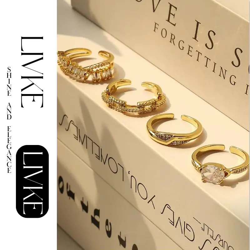 LIVKE’s gold open ring with cubic zirconia, stacked with silver bands for urban minimalist style.