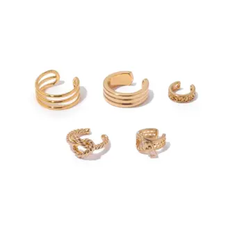 LIVKE’s gold openwork ear cuff styled on a helix, paired with minimalist hoops for edgy everyday elegance.