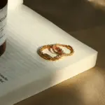 18K Gold Minimalist Ring 4 LIVKE’s 18K PVD gold minimalist ring stacked with raw-edge bands for modern gender-neutral style.