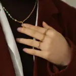 18K Gold Minimalist Ring 2 LIVKE’s 18K PVD gold minimalist ring stacked with raw-edge bands for modern gender-neutral style.