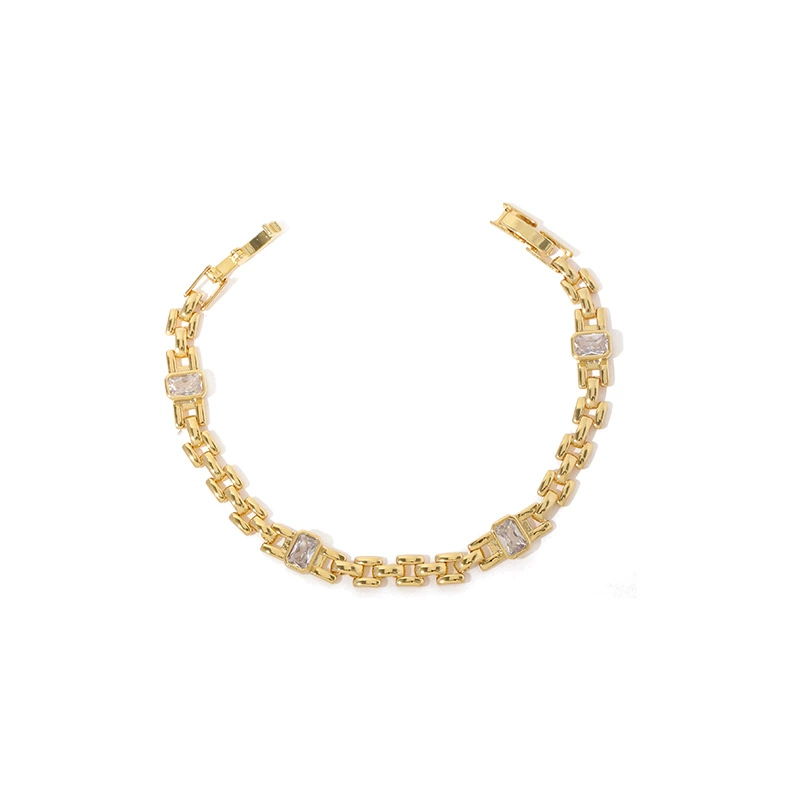 LIVKE’s gold watch band bracelet with geometric zirconia links, styled with a leather folio for modern power dressing.