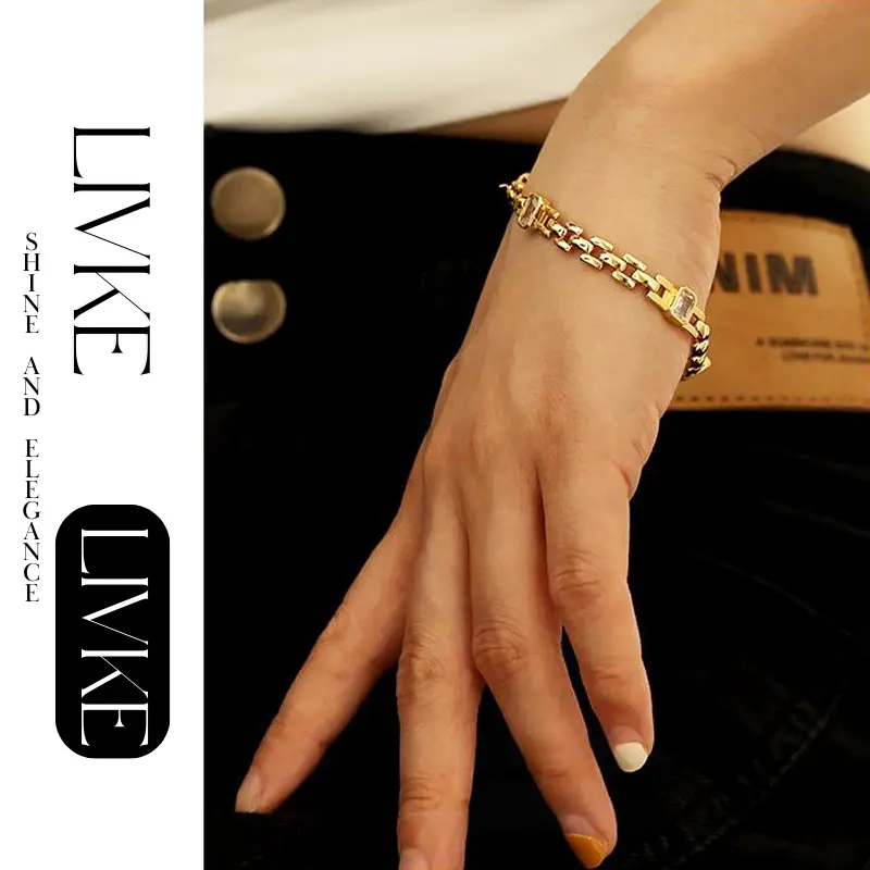 LIVKE’s gold watch band bracelet with geometric zirconia links, styled with a leather folio for modern power dressing.