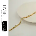 18K Gold-Plated Cubic Zirconia Watch Band Bracelet 4 LIVKE’s gold watch band bracelet with geometric zirconia links, styled with a leather folio for modern power dressing.