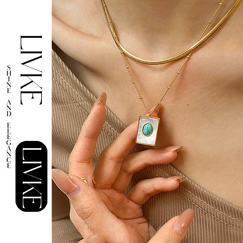 livke-boho-shell-turquoise-necklace (2) LIVKE’s gold snake chain necklace with shell and turquoise pendant, layered with beaded bracelets for boho summer style.