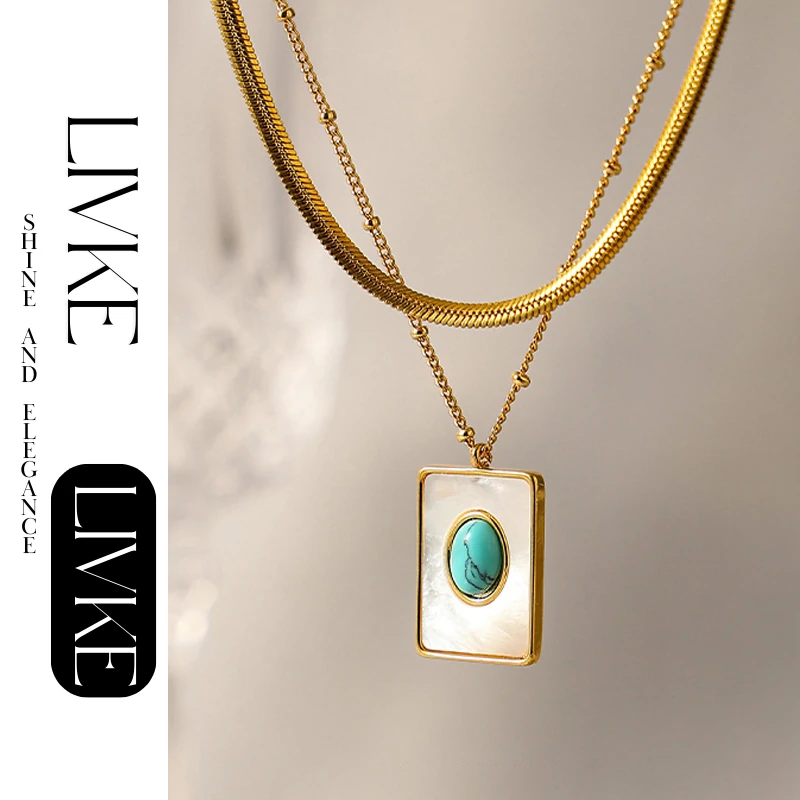 livke-boho-shell-turquoise-necklace (3) LIVKE’s gold snake chain necklace with shell and turquoise pendant, layered with beaded bracelets for boho summer style.