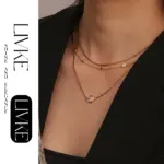 LIVKE’s gold minimalist zirconia necklace styled with a white blouse for office-ready elegance.