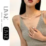 French-Inspired Enamel Heart Necklace 3 LIVKE’s gold enamel heart pendant necklace styled with a floral dress for Parisian-inspired everyday charm.