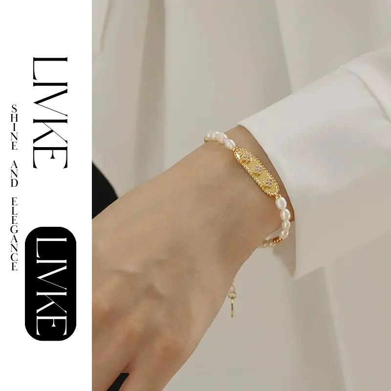 LIVKE’s French pearl bracelet with gold and zirconia accents, styled with a striped Breton top for effortless Parisian elegance.