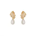 French-Inspired Vintage Pearl Earrings 1 LIVKE’s gold vintage pearl drop earrings with zirconia accents, styled with a black dress for Parisian evening elegance.