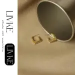 Geometric Square Hoop Earrings 3 LIVKE’s gold geometric square hoop earrings styled with a black turtleneck for minimalist urban elegance.