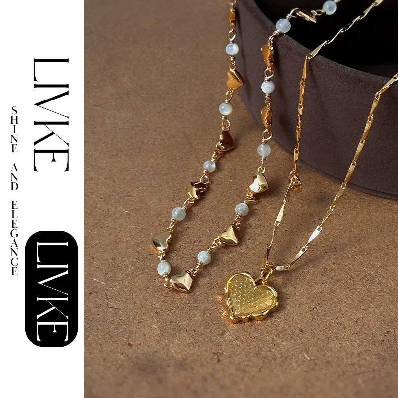 livke-layered-heart-shell-necklace-set LIVKE’s gold layered heart necklaces styled with a black turtleneck for minimalist everyday elegance.