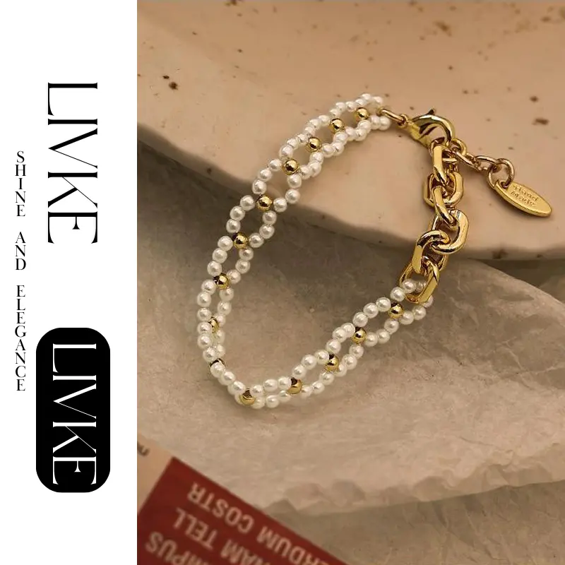LIVKE’s gold pearl chain bracelet styled on a wrist with a linen sleeve for boho everyday elegance.