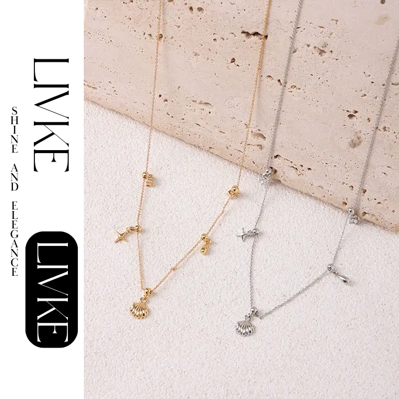 LIVKE’s gold summer wave necklace with shell and zirconia pendant, styled with a straw hat for beachside elegance.