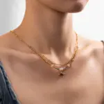 Tiger Eye Bead Necklace 2 LIVKE’s tiger eye bead necklace with gold and zirconia accents, styled with a linen dress for boho everyday elegance.