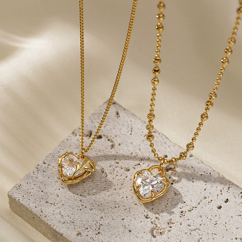 LIVKE’s gold vintage heart necklace with cubic zirconia, layered with a thin chain for minimalist office elegance.