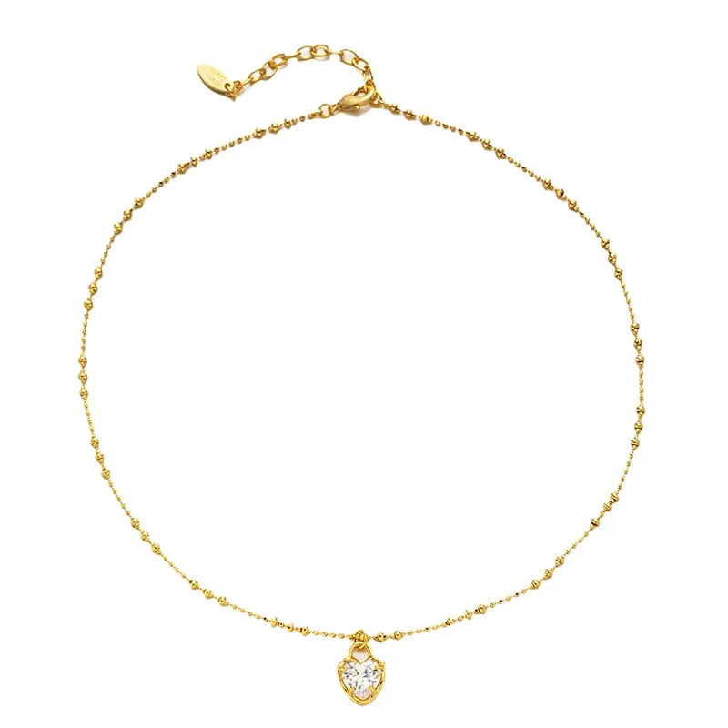 LIVKE’s gold vintage heart necklace with cubic zirconia, layered with a thin chain for minimalist office elegance.