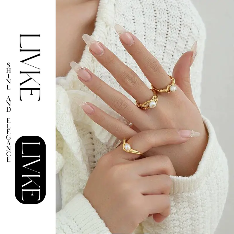 livke-vintage-pearl-gold-leaf-ring (2) LIVKE’s gold leaf and pearl adjustable ring on a hand with neutral nails, styled with a linen dress for effortless boho elegance.