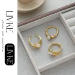 Vintage Gold Leaf Pearl Ring 4 LIVKE’s gold leaf and pearl adjustable ring on a hand with neutral nails, styled with a linen dress for effortless boho elegance.