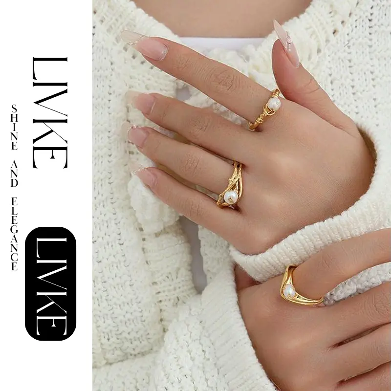 livke-vintage-pearl-gold-leaf-ring LIVKE’s gold leaf and pearl adjustable ring on a hand with neutral nails, styled with a linen dress for effortless boho elegance.