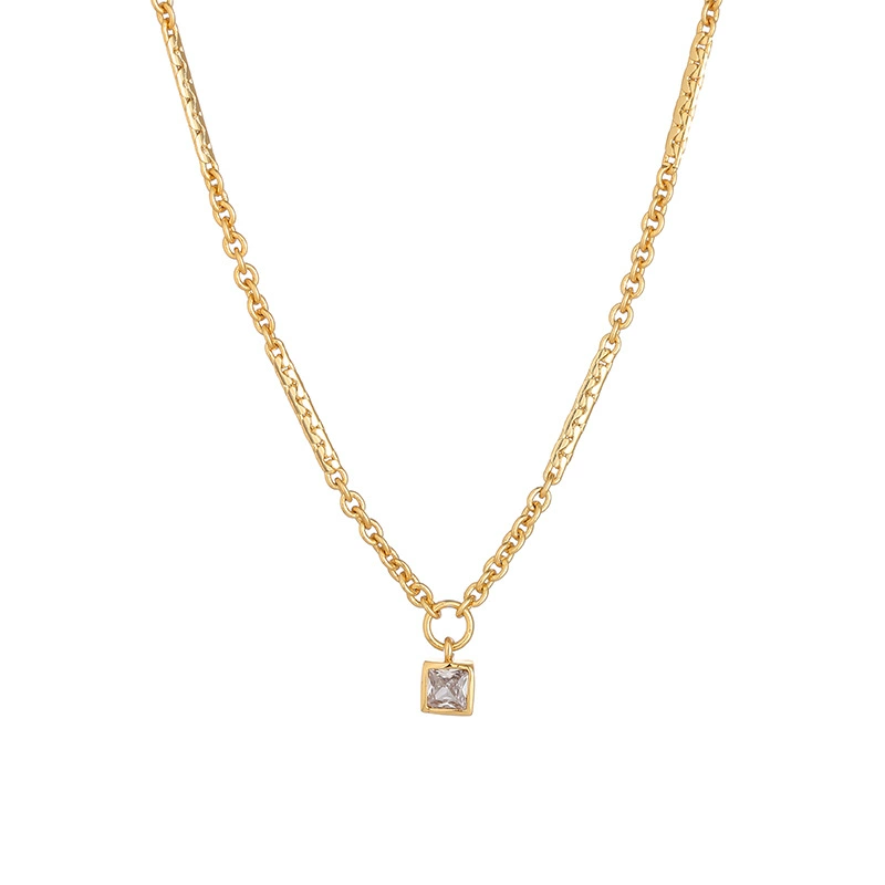 livke-vintage-square-zircon-necklace LIVKE’s gold-plated square zircon pendant necklace styled with a white silk blouse for timeless elegance.