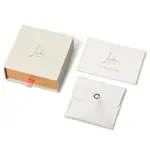 Jewelry Care Set 1 Beige drawer box open with polishing cloth, necklace and ring on velvet background