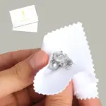 Close-up of a microfiber jewelry polishing cloth showing textured and smooth sides