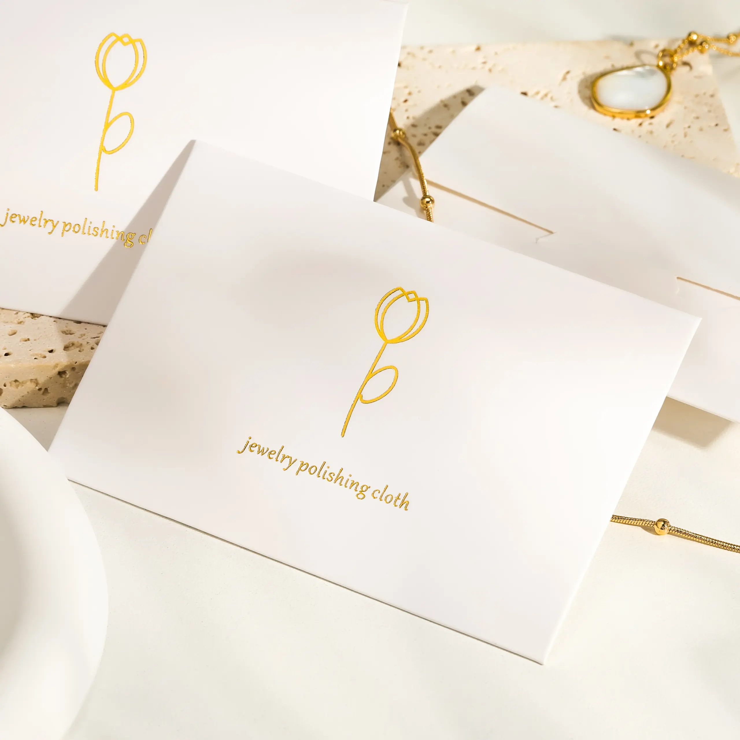 Close-up of a microfiber jewelry polishing cloth showing textured and smooth sides