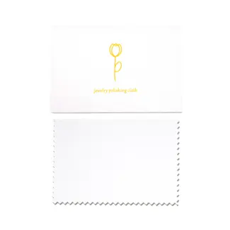 Close-up of a microfiber jewelry polishing cloth showing textured and smooth sides