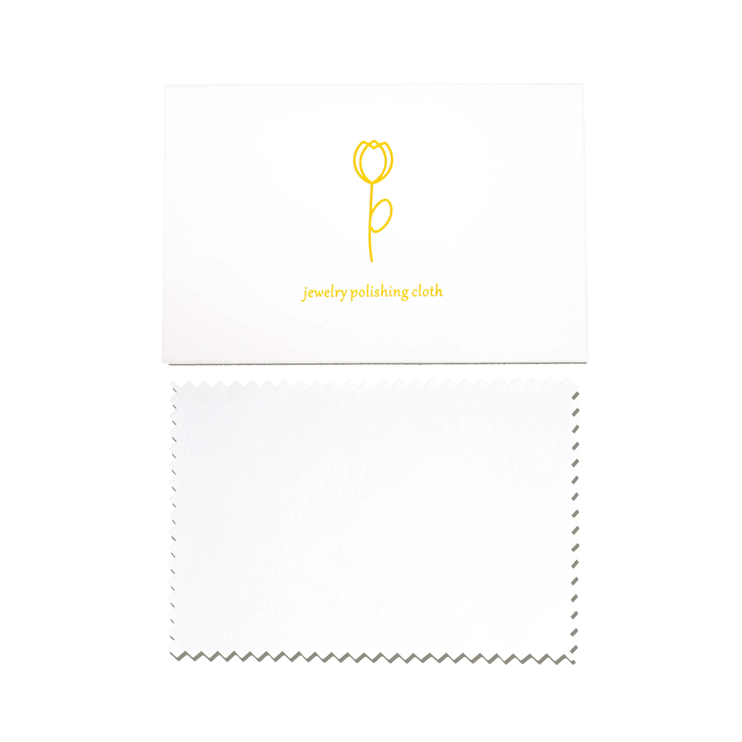 Close-up of a microfiber jewelry polishing cloth showing textured and smooth sides