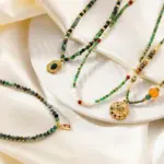 18K Gold-Plated Brass Natural Stone Necklace 8 Adjustable LIVKE brass necklace with amethyst and turquoise beads layered over linen dress for bohemian everyday style.