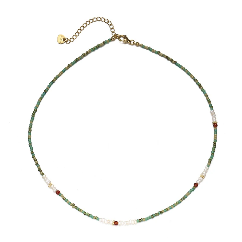 Adjustable LIVKE brass necklace with amethyst and turquoise beads layered over linen dress for bohemian everyday style.