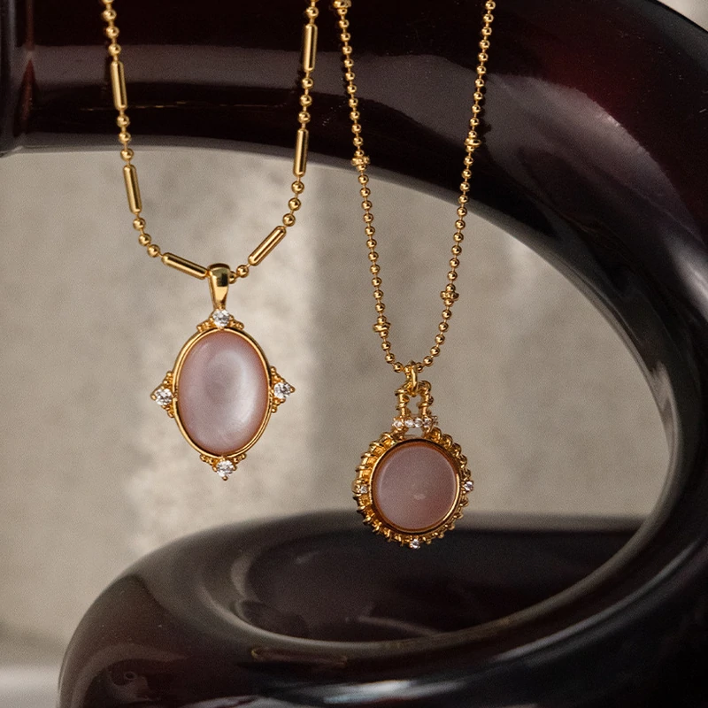 Woman wearing LIVKE vintage cubic zirconia necklace with turtleneck and trench coat, showcasing minimalist retro jewelry for urban elegance