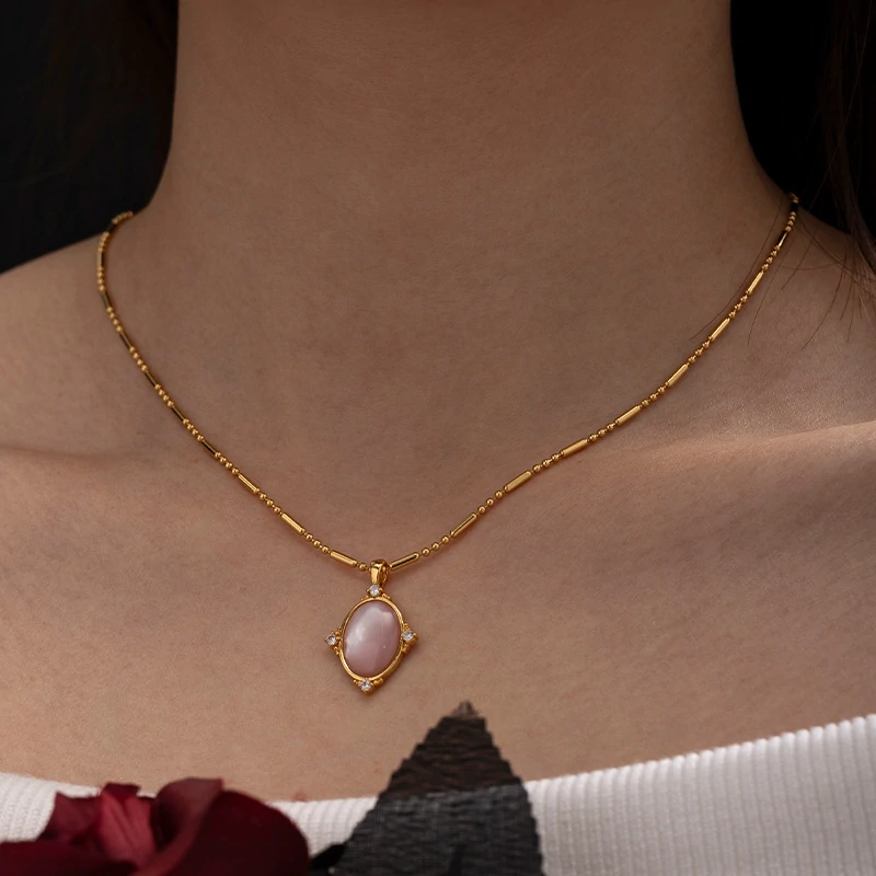 Woman wearing LIVKE vintage cubic zirconia necklace with turtleneck and trench coat, showcasing minimalist retro jewelry for urban elegance