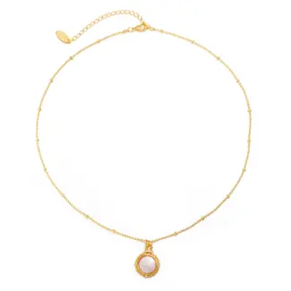 Woman wearing LIVKE vintage cubic zirconia necklace with turtleneck and trench coat, showcasing minimalist retro jewelry for urban elegance