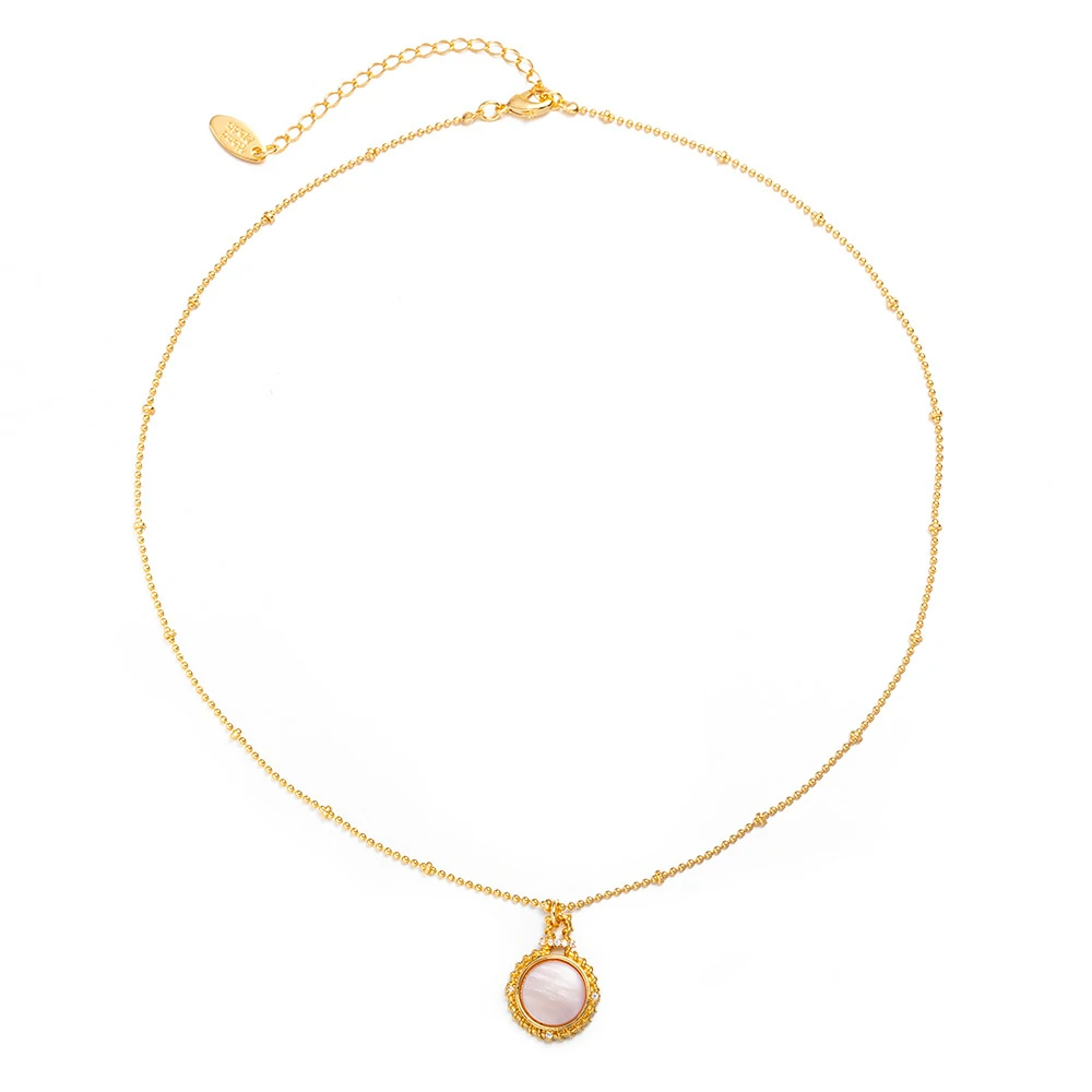 Woman wearing LIVKE vintage cubic zirconia necklace with turtleneck and trench coat, showcasing minimalist retro jewelry for urban elegance