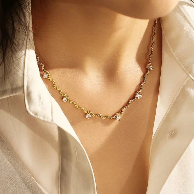 livke-18kgold-asymmetric-chain-necklace-layered-stac LIVKE 18K gold-plated asymmetric chain necklace with cubic zirconia stones, layered with minimalist bar pendant for day-to-night jewelry styling