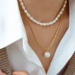 18K Gold Plated Pearl Pendant Necklace 2 Woman wearing LIVKE braided gold chain pearl necklace with tailored blouse, showcasing minimalist office jewelry