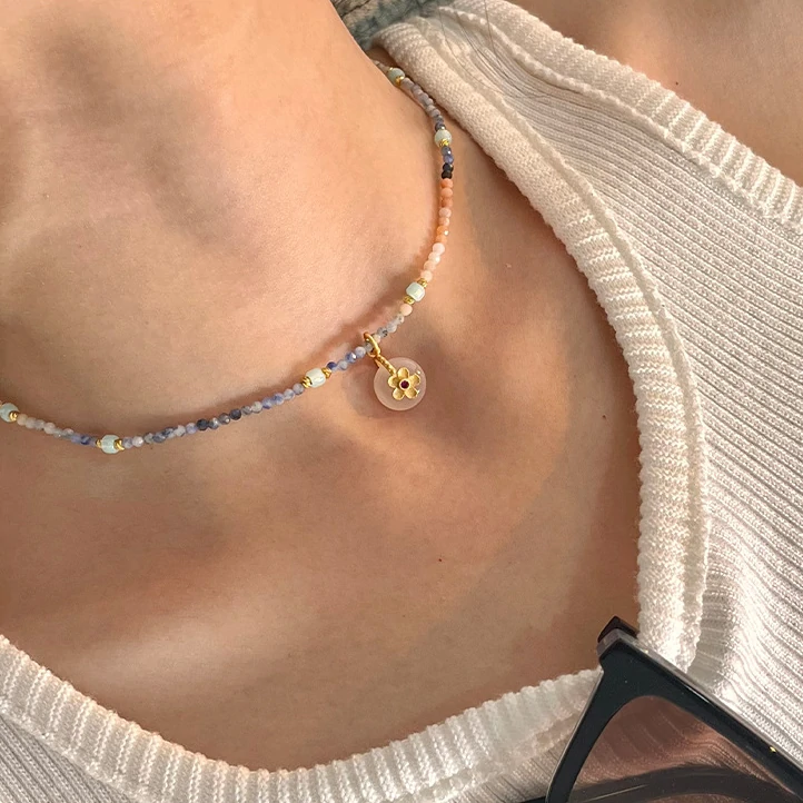 Woman in hanfu wearing LIVKE floral crystal necklace, blending traditional Chinese aesthetics with modern minimalist jewelry