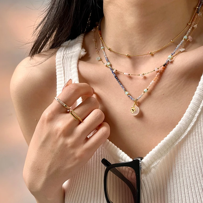 Woman in hanfu wearing LIVKE floral crystal necklace, blending traditional Chinese aesthetics with modern minimalist jewelry