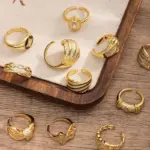 Artisan Zirconium Ring Set 17 Woman stacking LIVKE textured gold rings with UV color shift effect for TikTok transition video