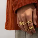 Artisan Zirconium Ring Set 14 Woman stacking LIVKE textured gold rings with UV color shift effect for TikTok transition video