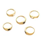 Hand wearing LIVKE contrast heart ring with black and white enamel, paired with both tailored suit and casual denim